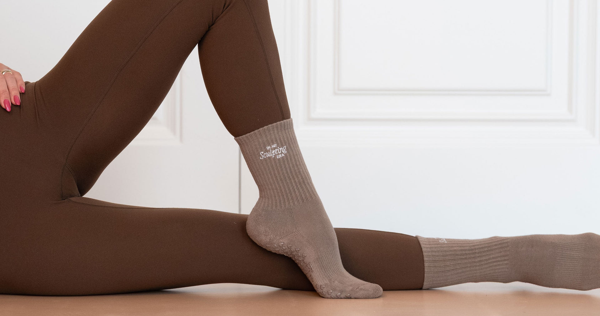 Grip socks worn on a studio floor